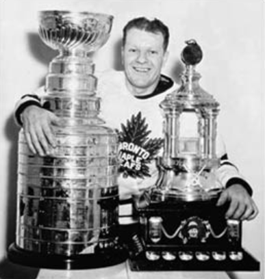 Turk Broda in 1948 with the Stanley Cup and Vezina trophy